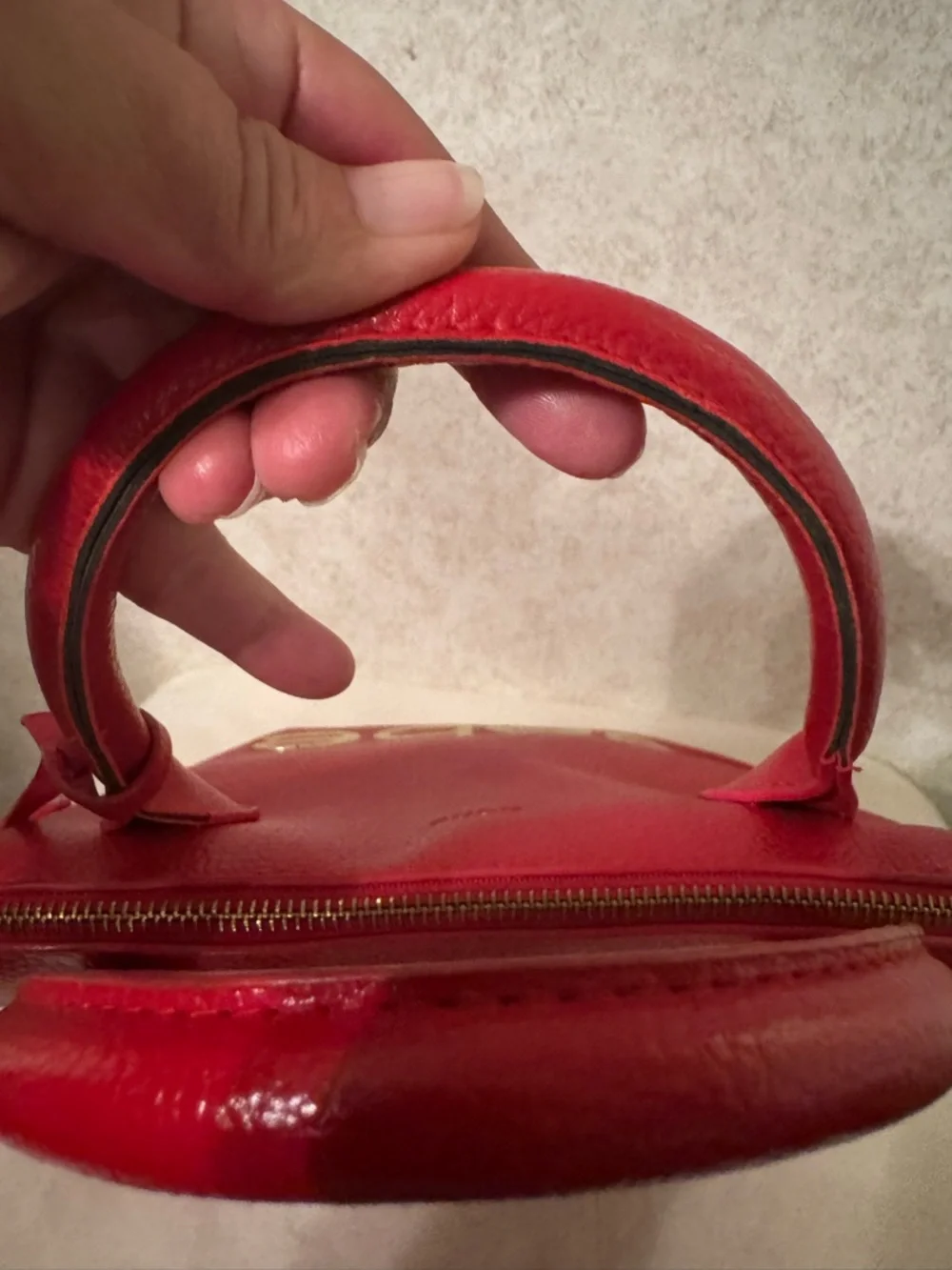 bebe Red Pebbled Fabiola Leather Satchel with Gold Logo Accent with strap.